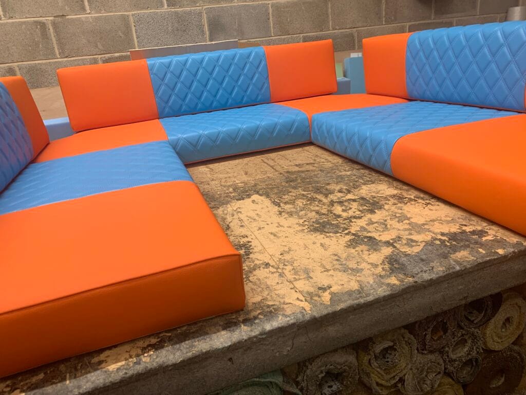 Orange and blue U-shaped camper seating